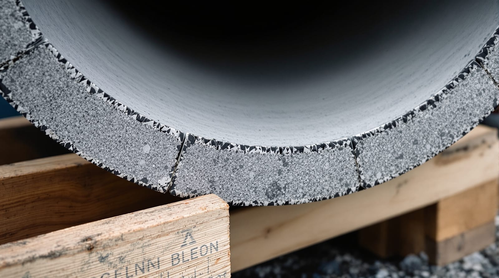 Bell end of a reinforced concrete pipe section showing the tongue and groove joint profile